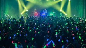 Hundreds of people enjoying a silent disco event with glowing LED headphones - Silent Disco Party UK